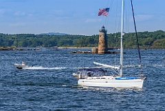 Boats Pass Stone Tower of Whaleback Lighthouse in Maine